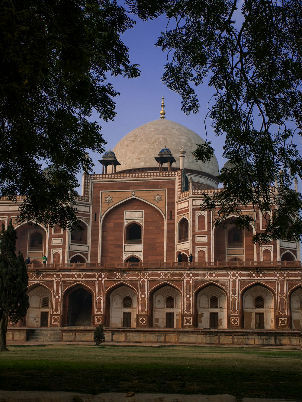 a large brick building with a dome on top