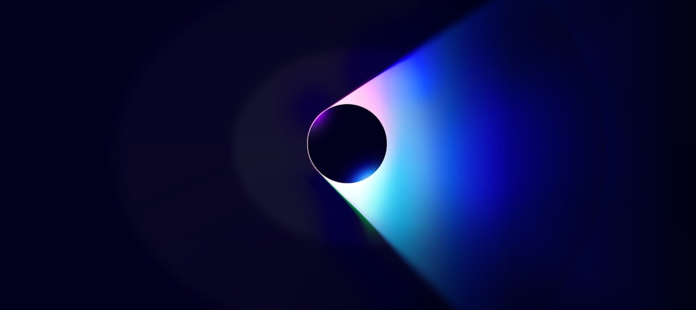 a black hole with a blue light coming out of it