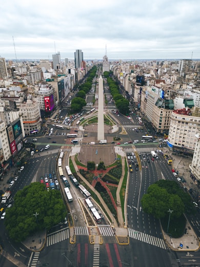 an aerial view of a city with a monument in the middle