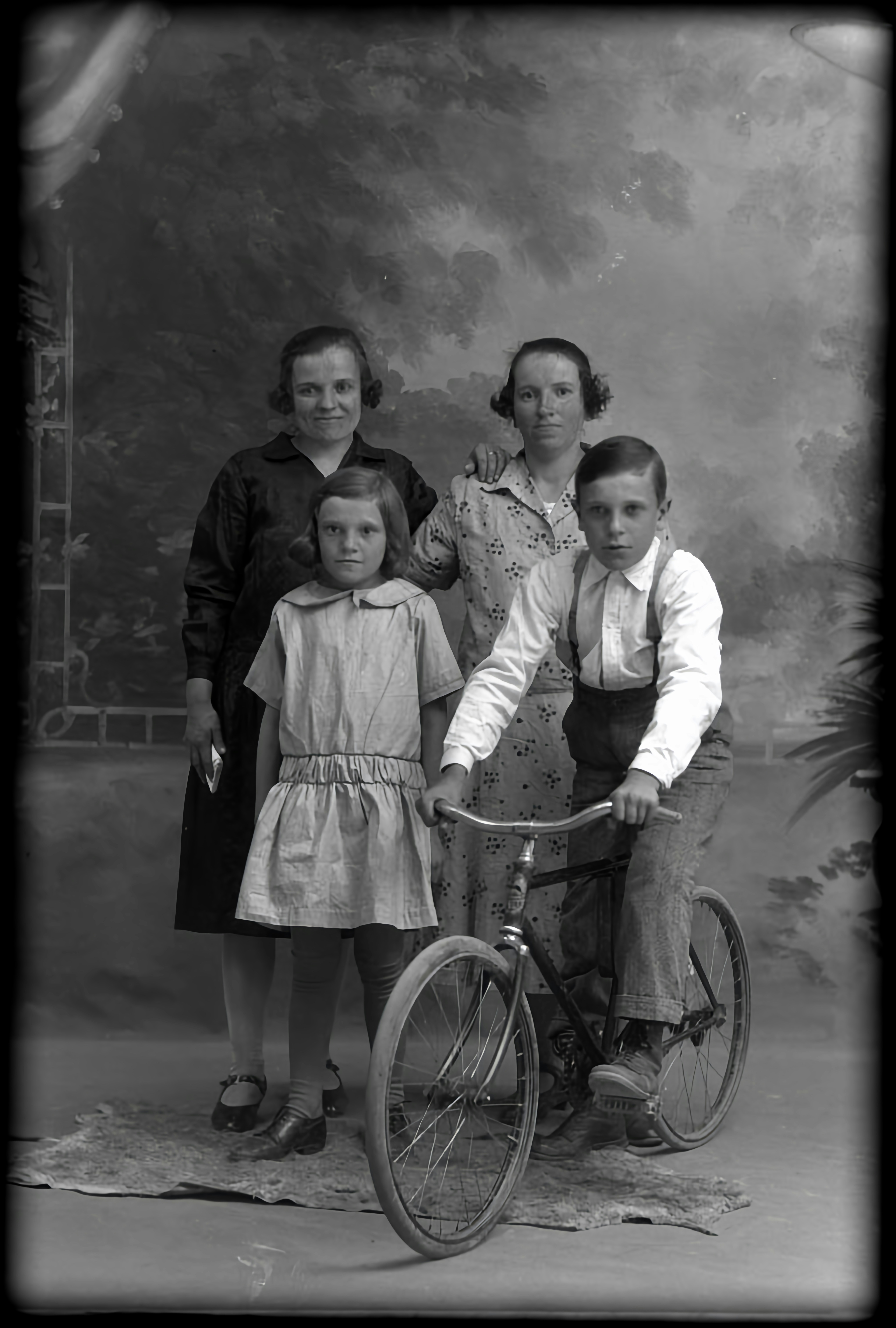 a black and white photo of a family posing for a picture