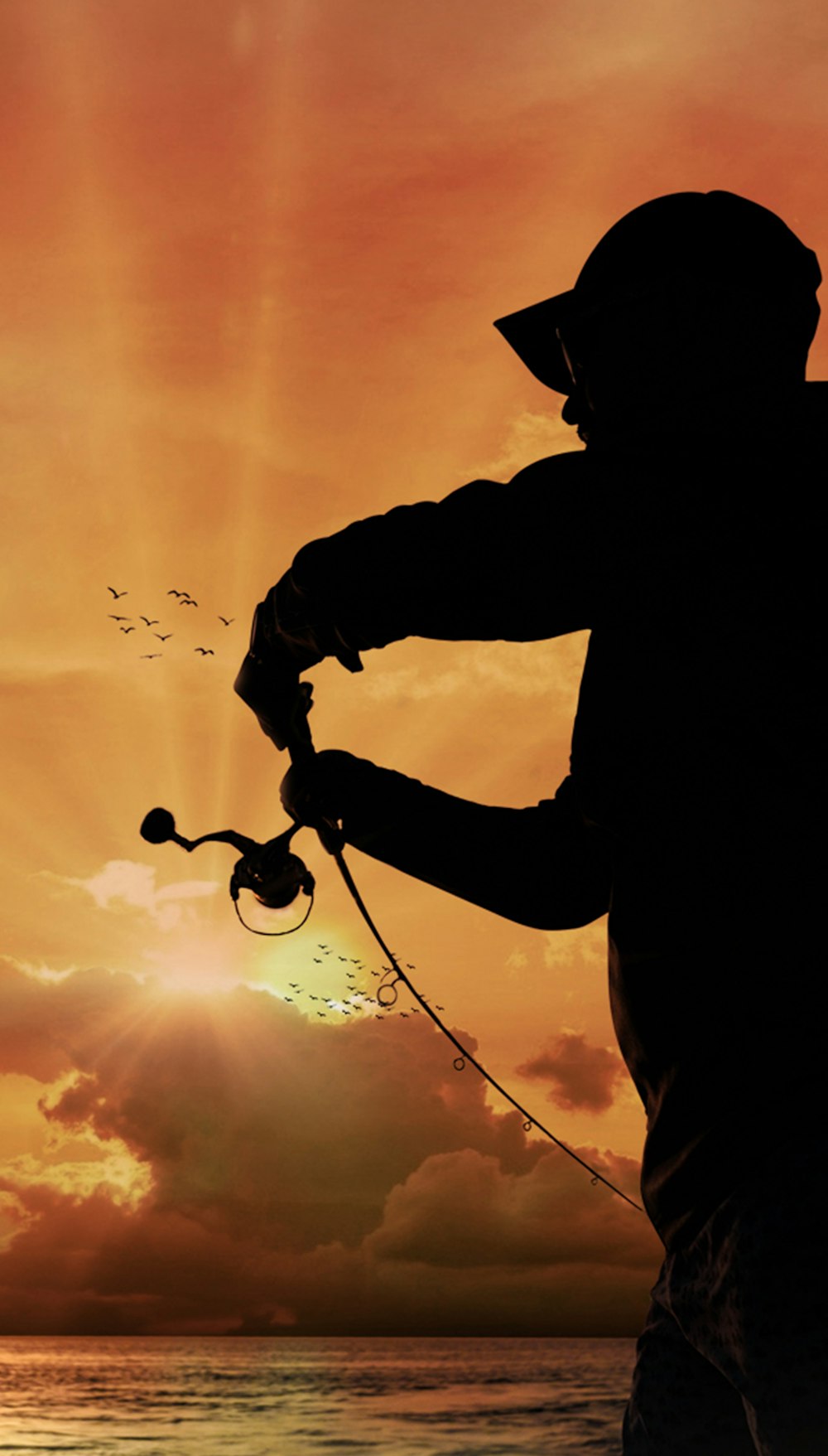 a silhouette of a man fishing at sunset