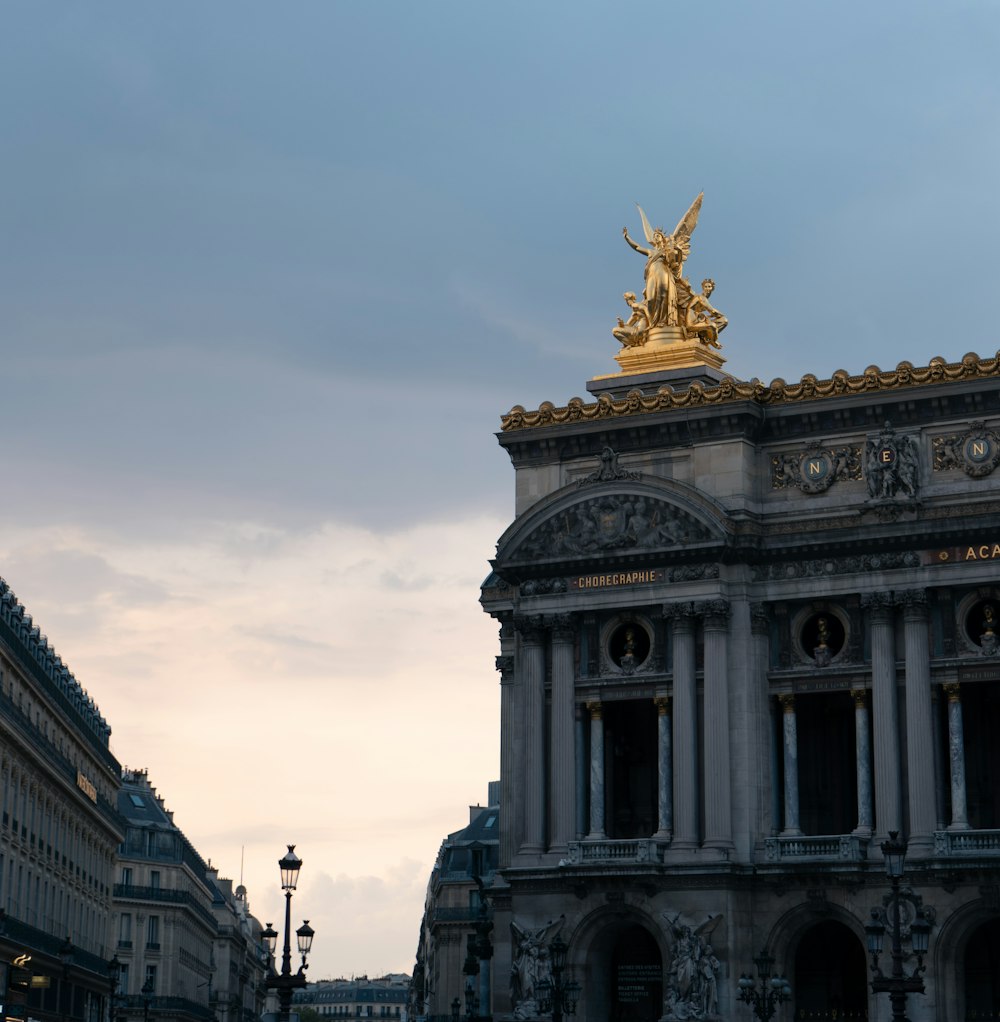 a building with a golden statue on top of it