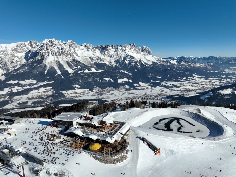 a view of a ski resort with mountains in the background