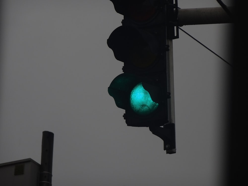 a traffic light with a green light on it