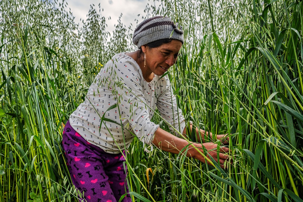 a woman in a field of tall grass