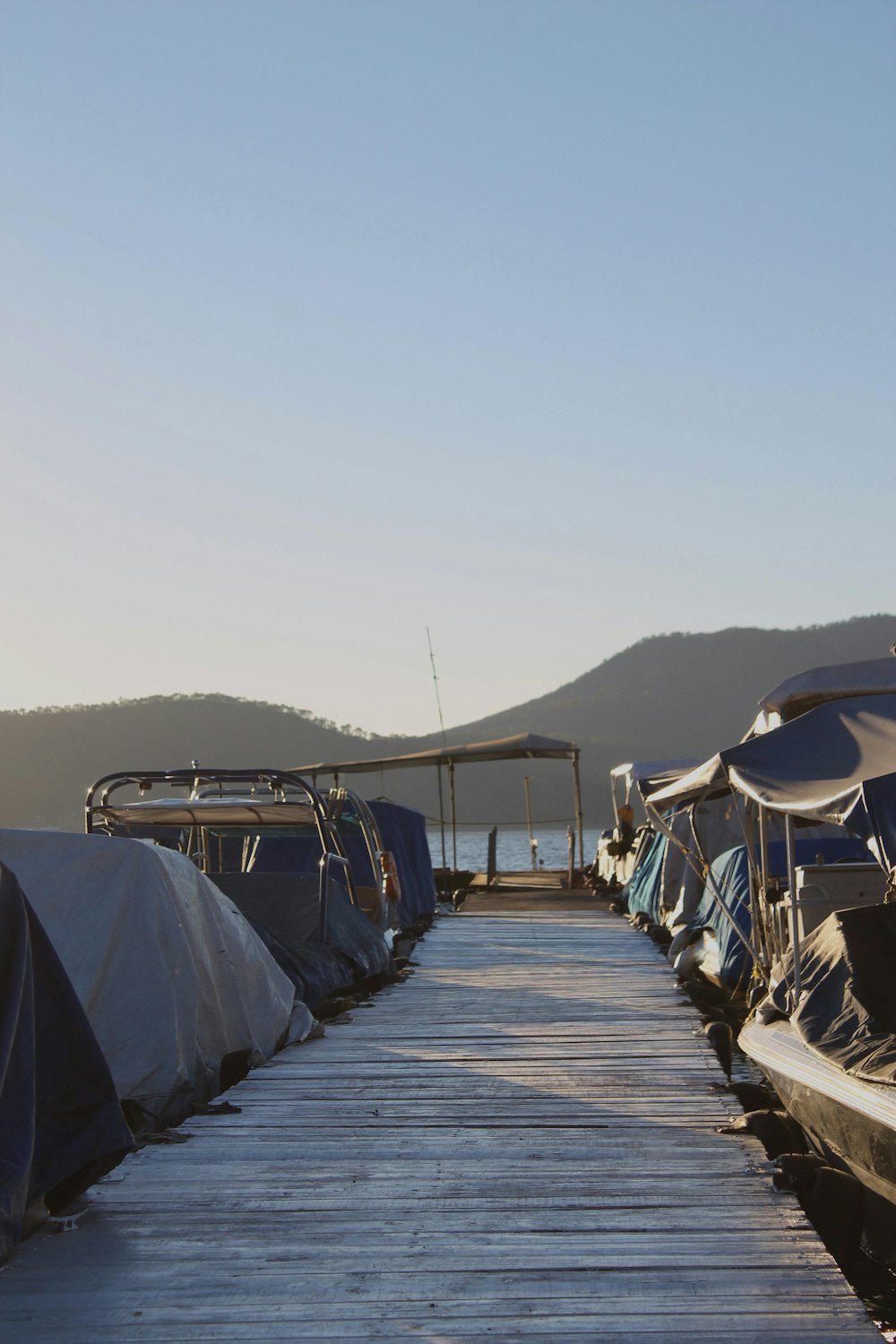 a dock that has several boats on it