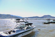 a boat is parked in the water near a dock