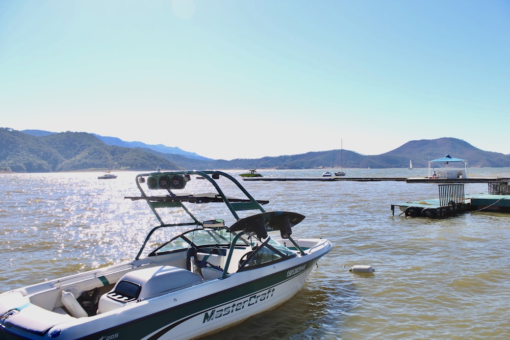 a boat is parked in the water near a dock