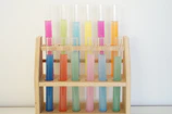 Array of colorful Biosystems reagent solutions in clear glass containers
