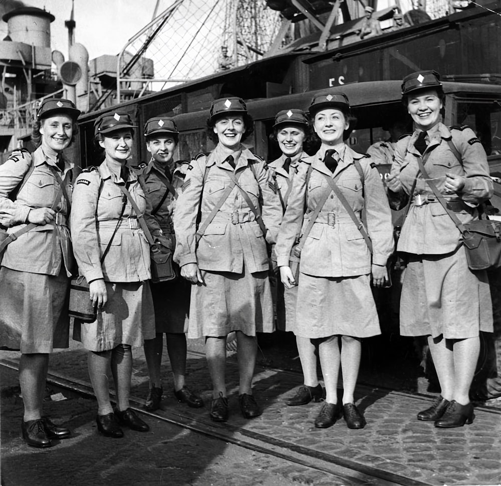 a group of women in uniforms standing next to each other