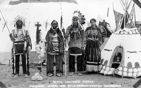 A serene photo of Native American elders performing a traditional healing ceremony outdoors.