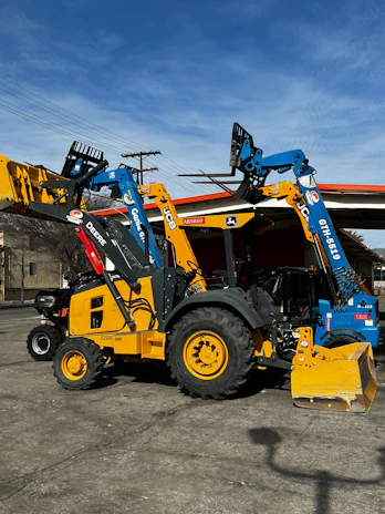 Modern construction equipment parked neatly at a job site ready for use