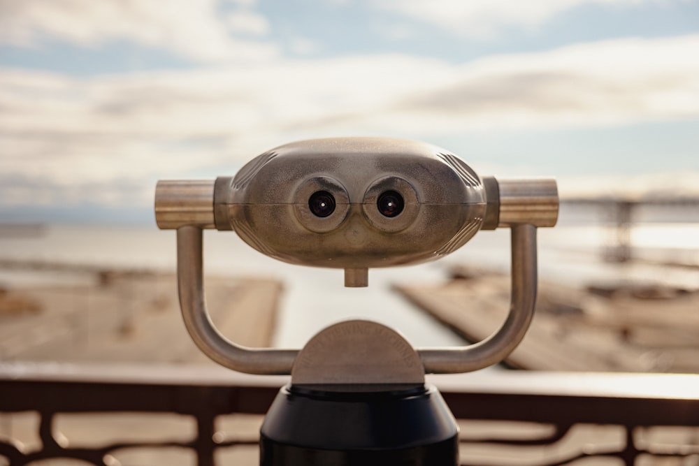 a close up of a camera with a sky in the background