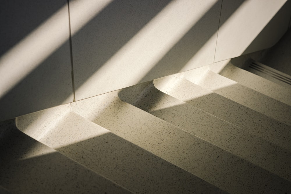 the shadow of a stair case on a wall