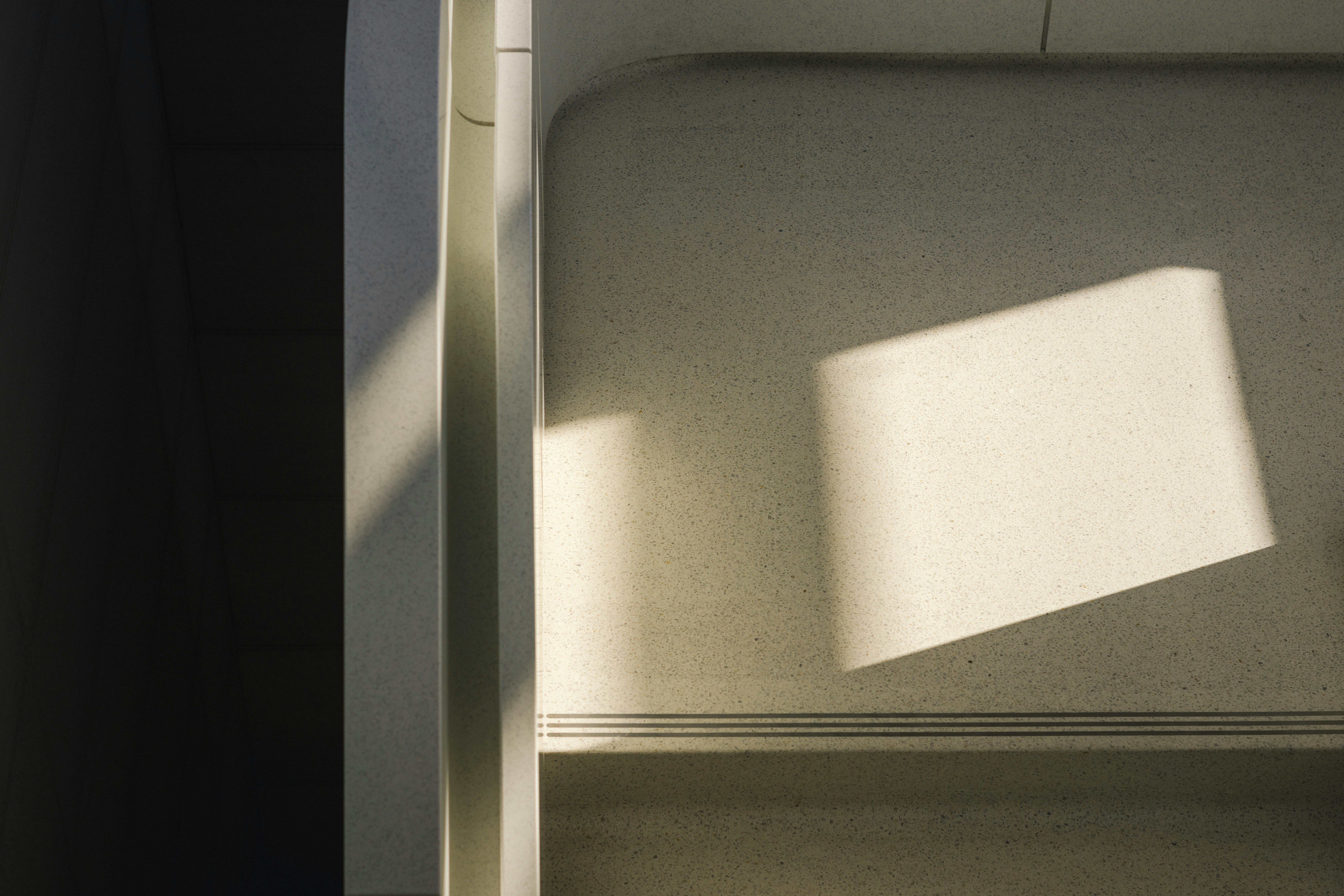 the shadow of a window on a wall