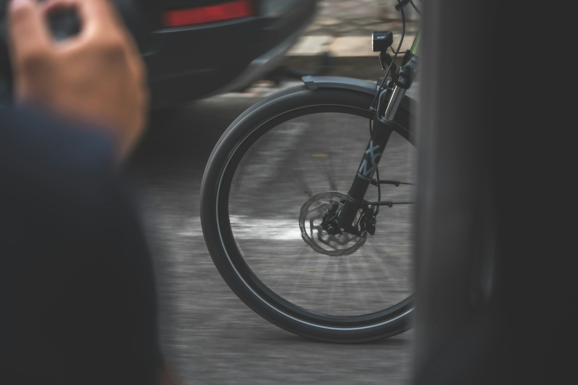 A blurred background of a bicycle in motion on a sunny day, emphasizing speed and movement.