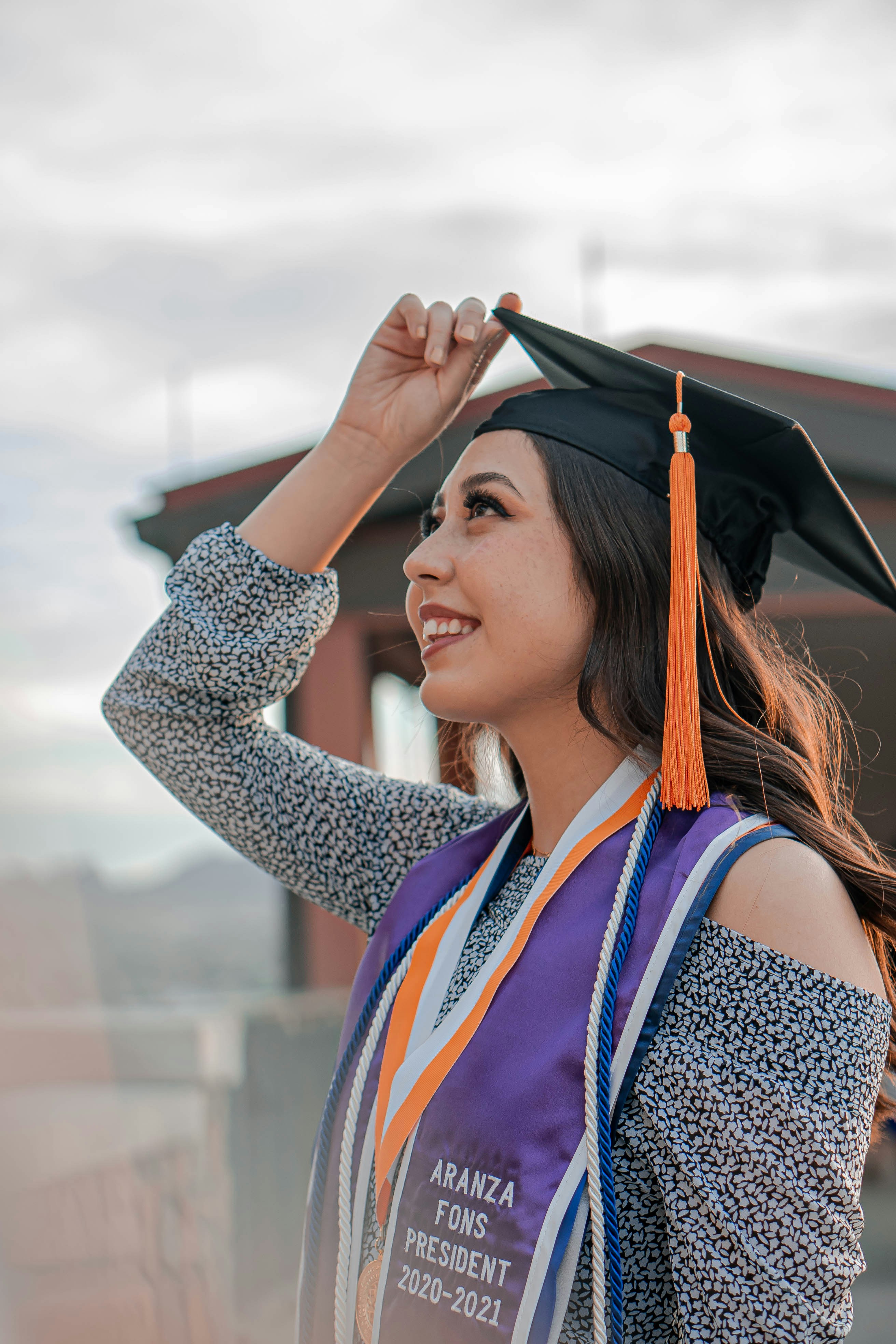 A woman in a graduation cap and gown photo Free El paso Image on Unsplash