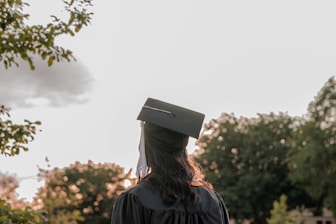 a woman wearing a graduation cap and gown