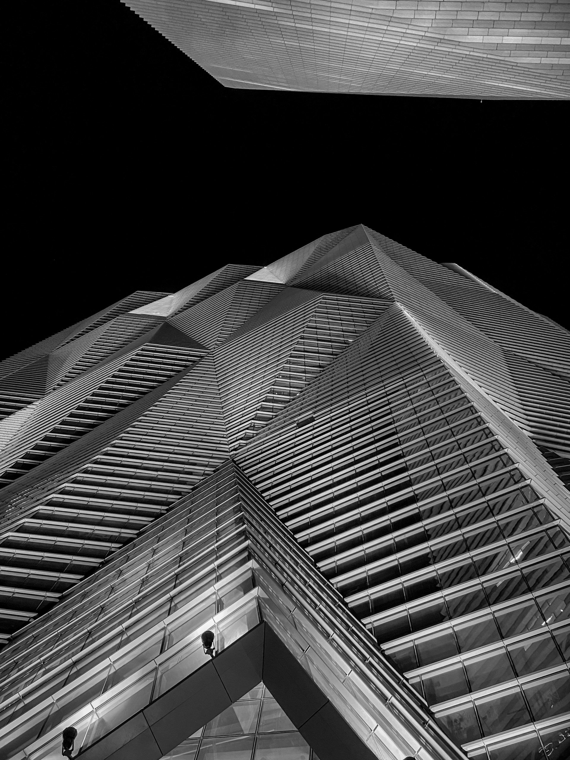 a black and white photo of a tall building