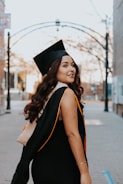 a woman in a graduation cap and gown