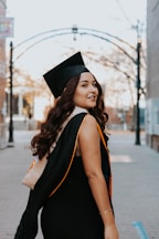 a woman in a graduation cap and gown