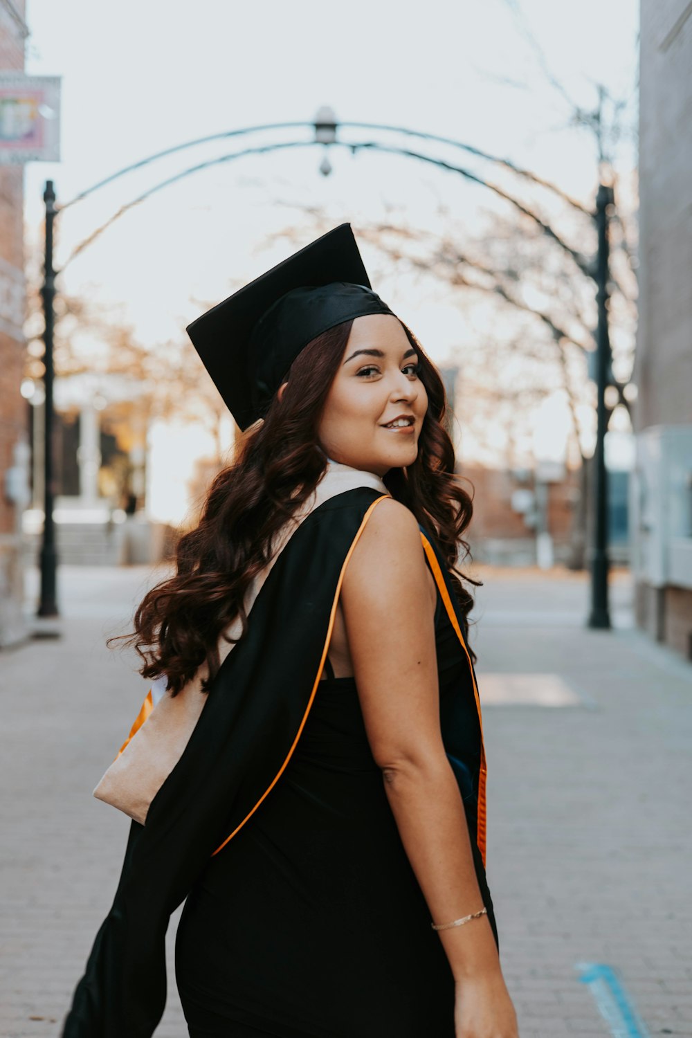 a woman in a graduation cap and gown