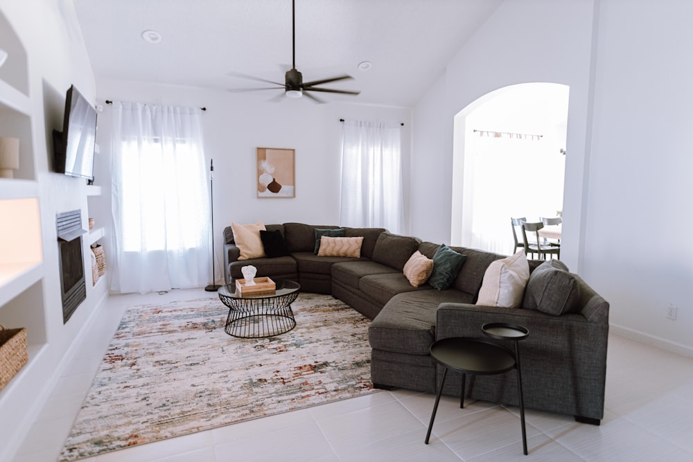 a living room filled with furniture and a large rug