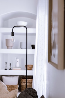 a bedroom with a bed and a lamp