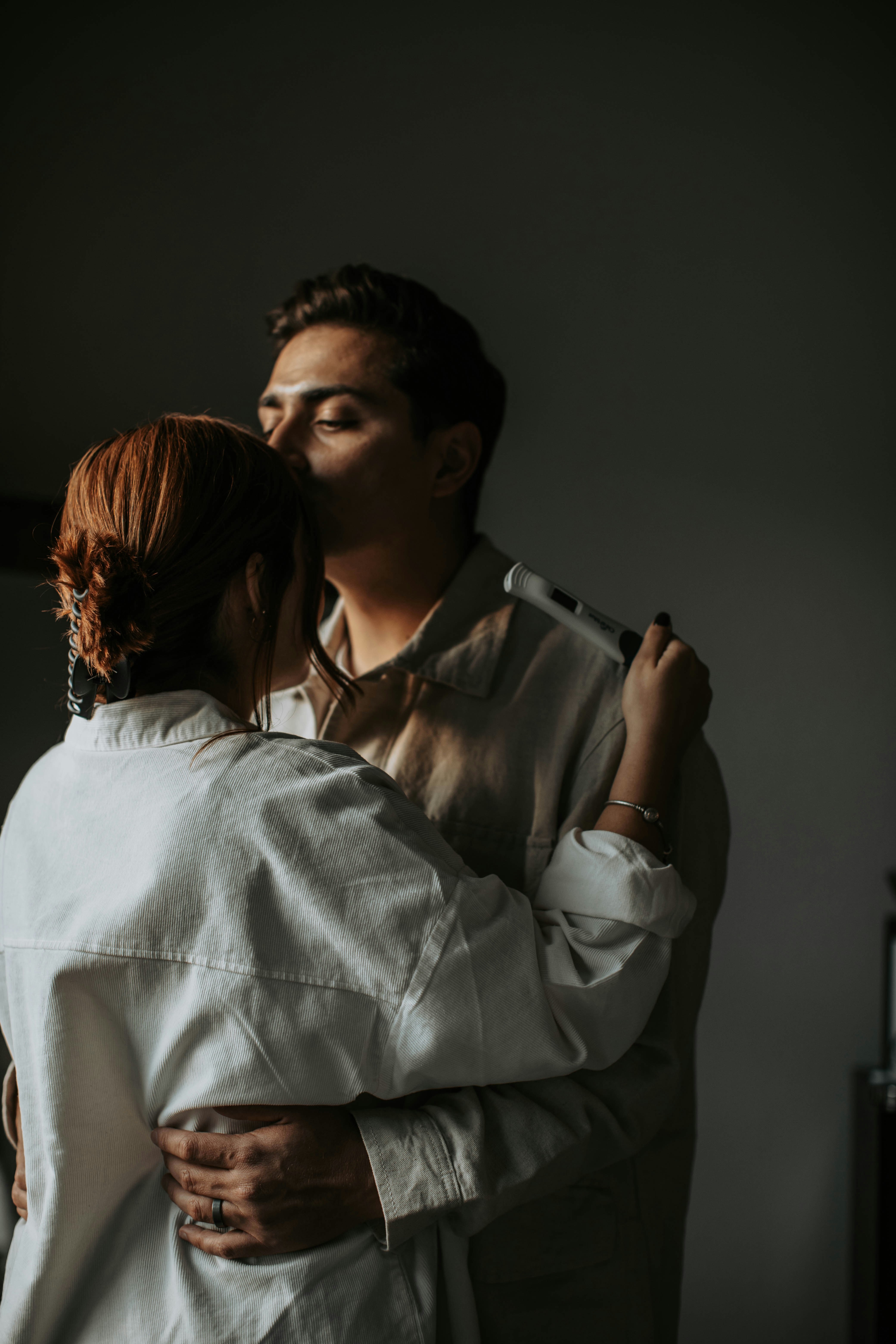 a man and a woman embracing each other