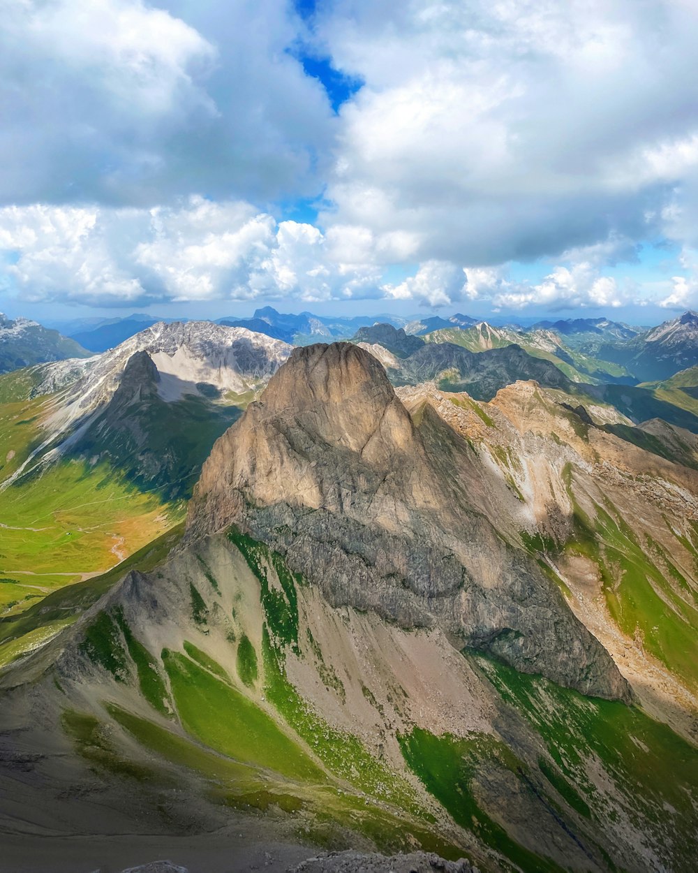 a view of a mountain range from the top of a mountain