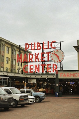 a public market center with cars parked in front of it