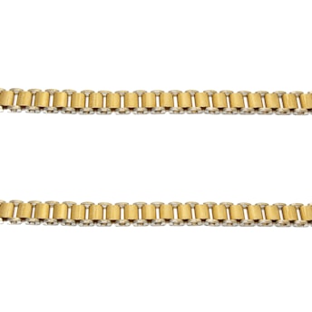 Two parallel gold chains are positioned horizontally against a plain white background. The links of the chains are cylindrical and interconnected evenly.