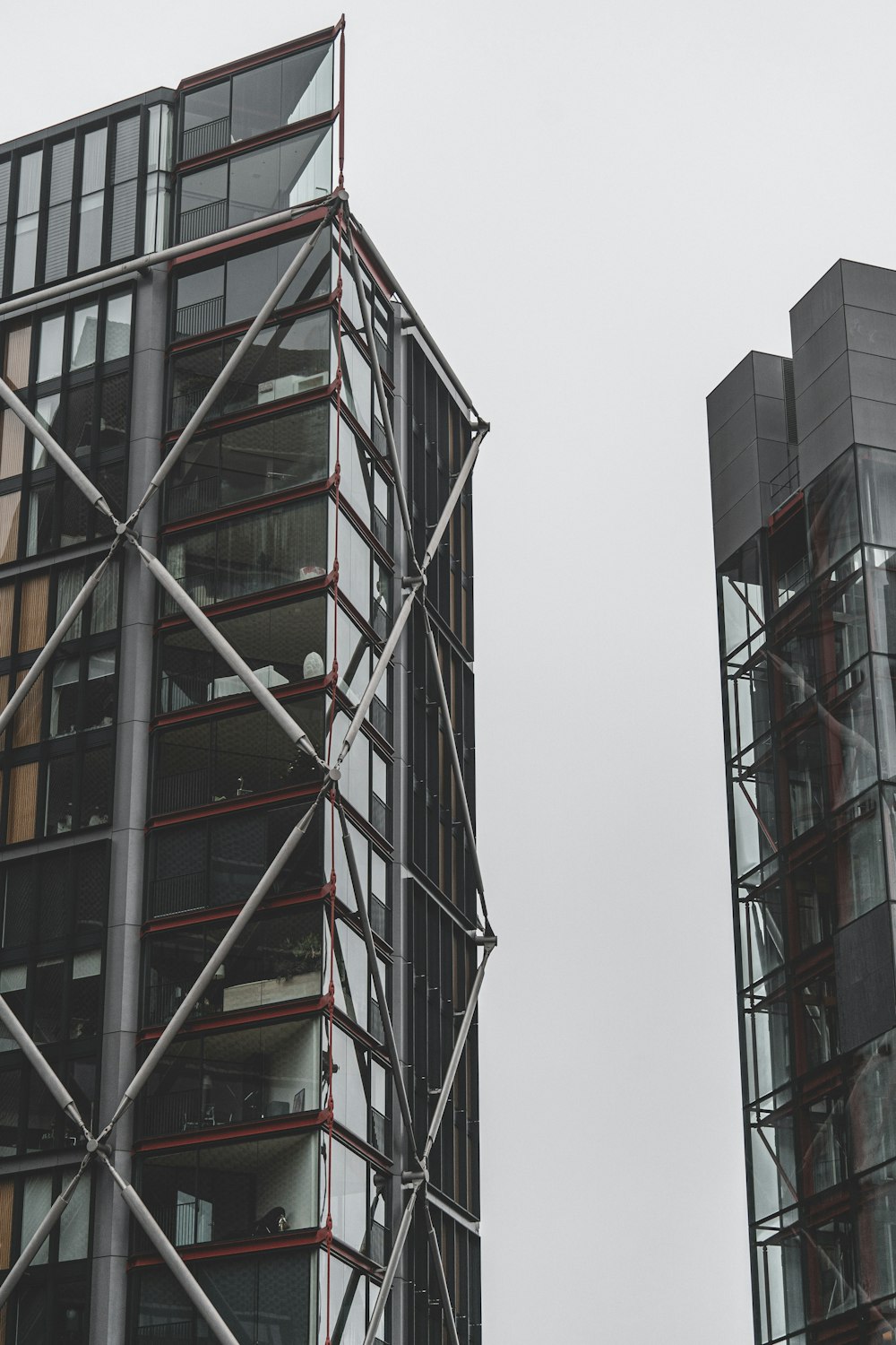 two tall buildings with scaffolding around them