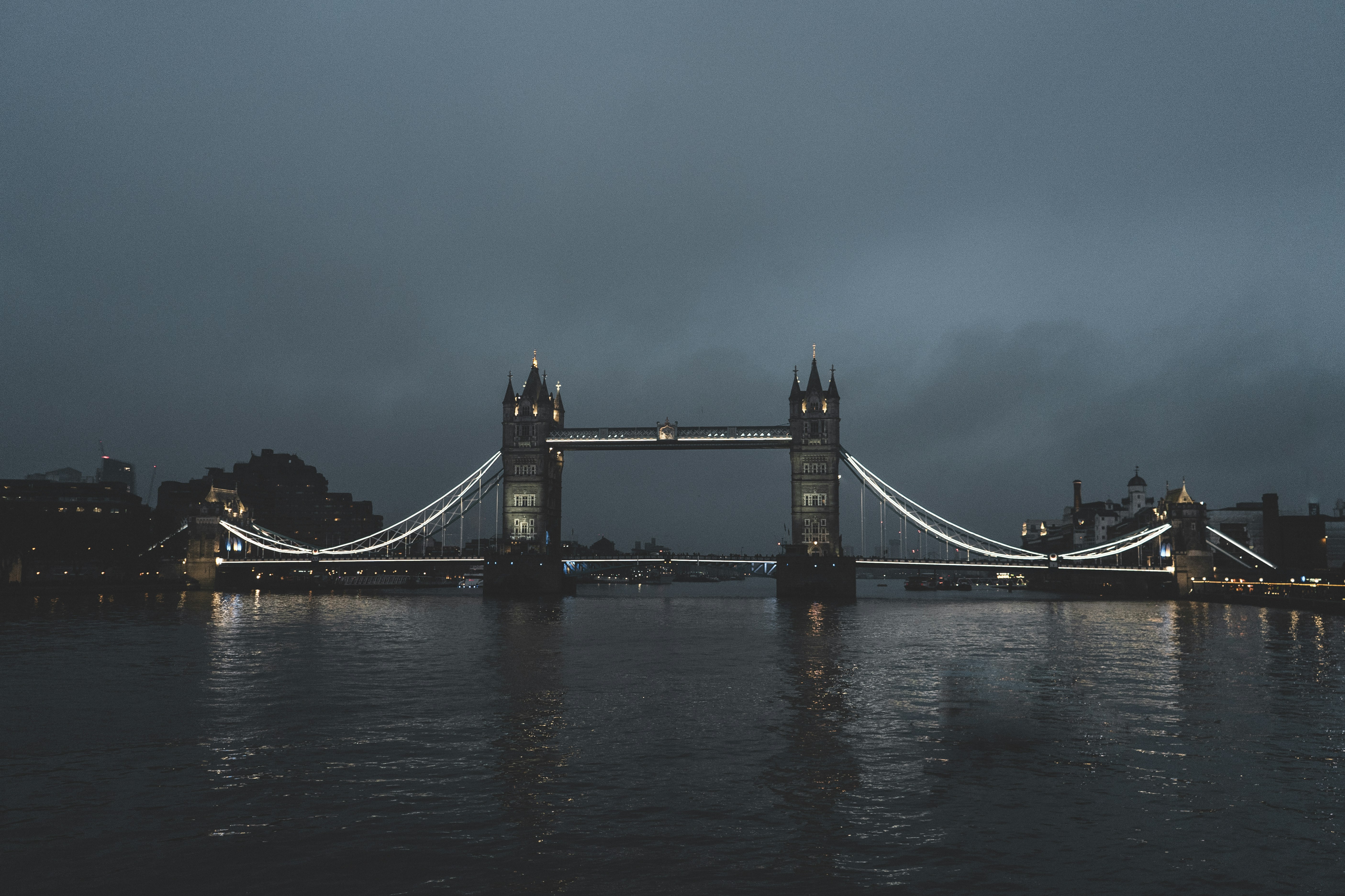 a view of the london bridge at night