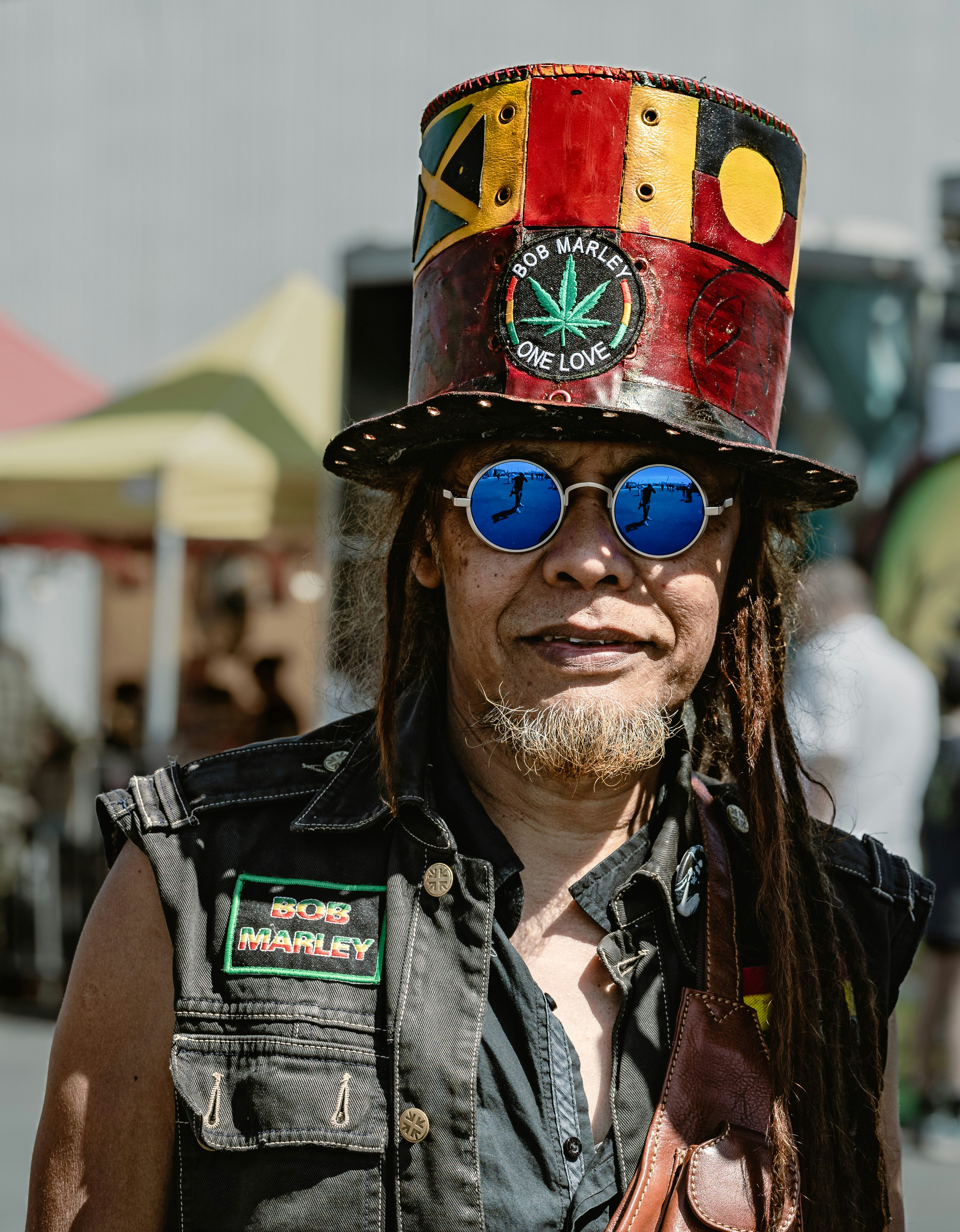 a man with a hat and sunglasses on
