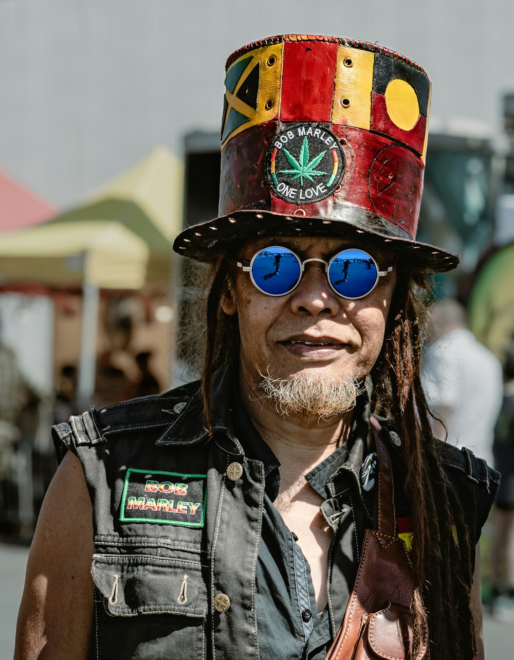 a man with a hat and sunglasses on