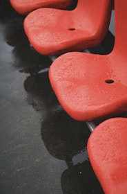 Close-up of a waterproof patio chair cover repelling water droplets on a rainy day.