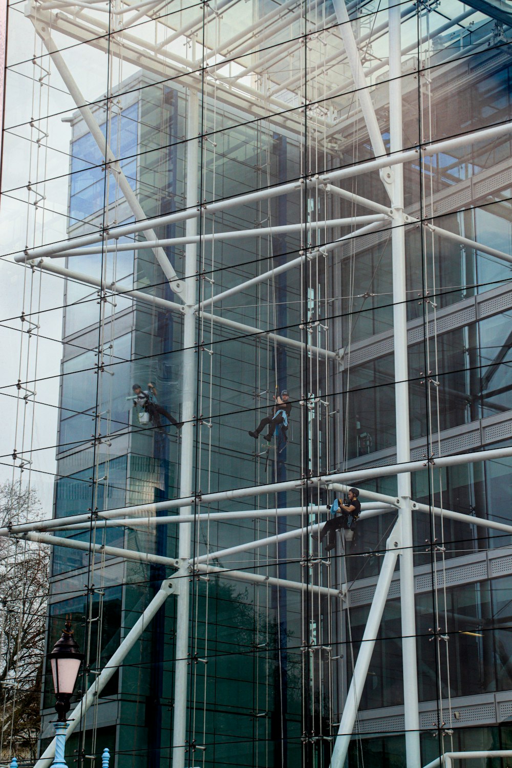a man on a scaffolding system working on a building