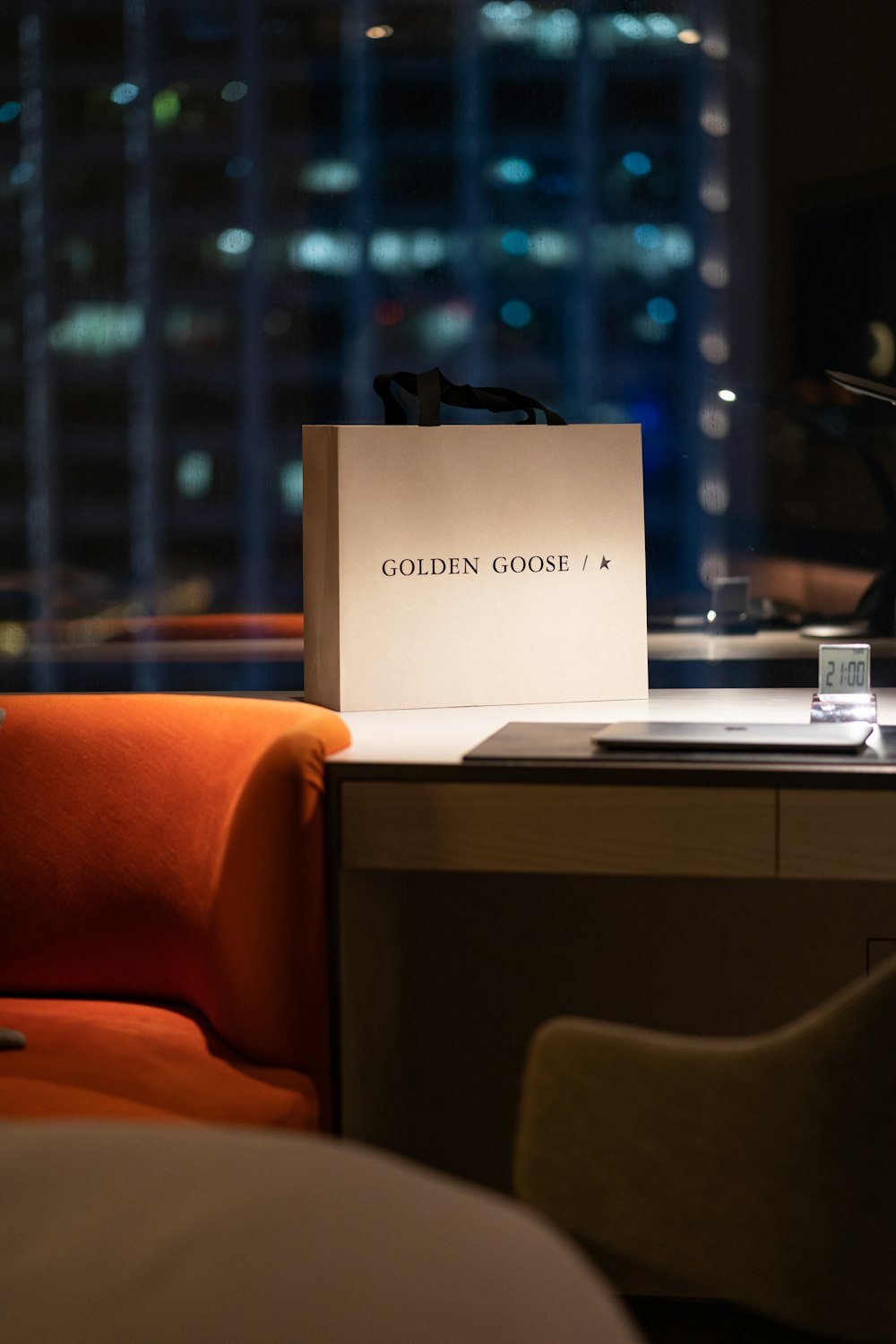 a bag sitting on top of a table next to a chair