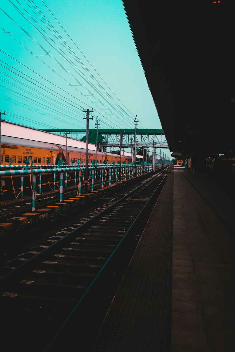 a train on a train track next to a train station