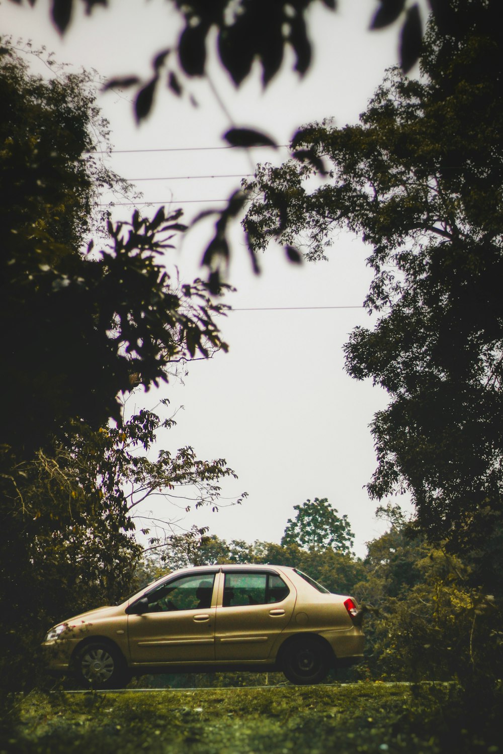 a car is parked in the middle of a field