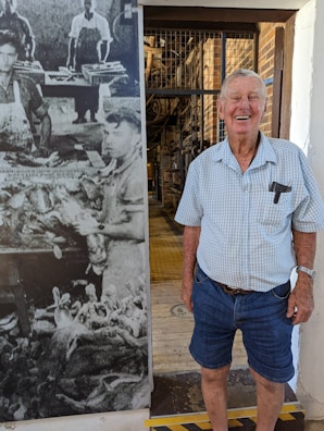 Historic black-and-white photo of Birla family founders at the original textile mill.