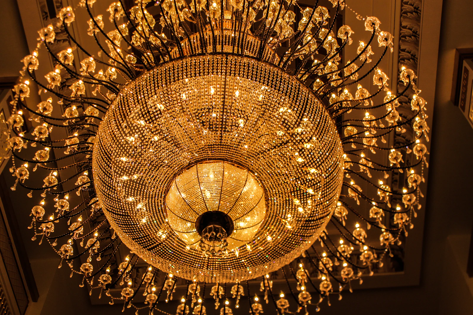 Chandelier hanging in a room, sized to the space