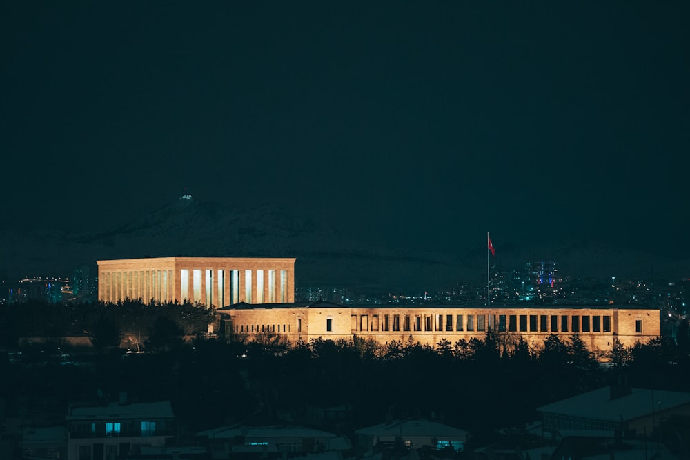 a night view of a building with lights on