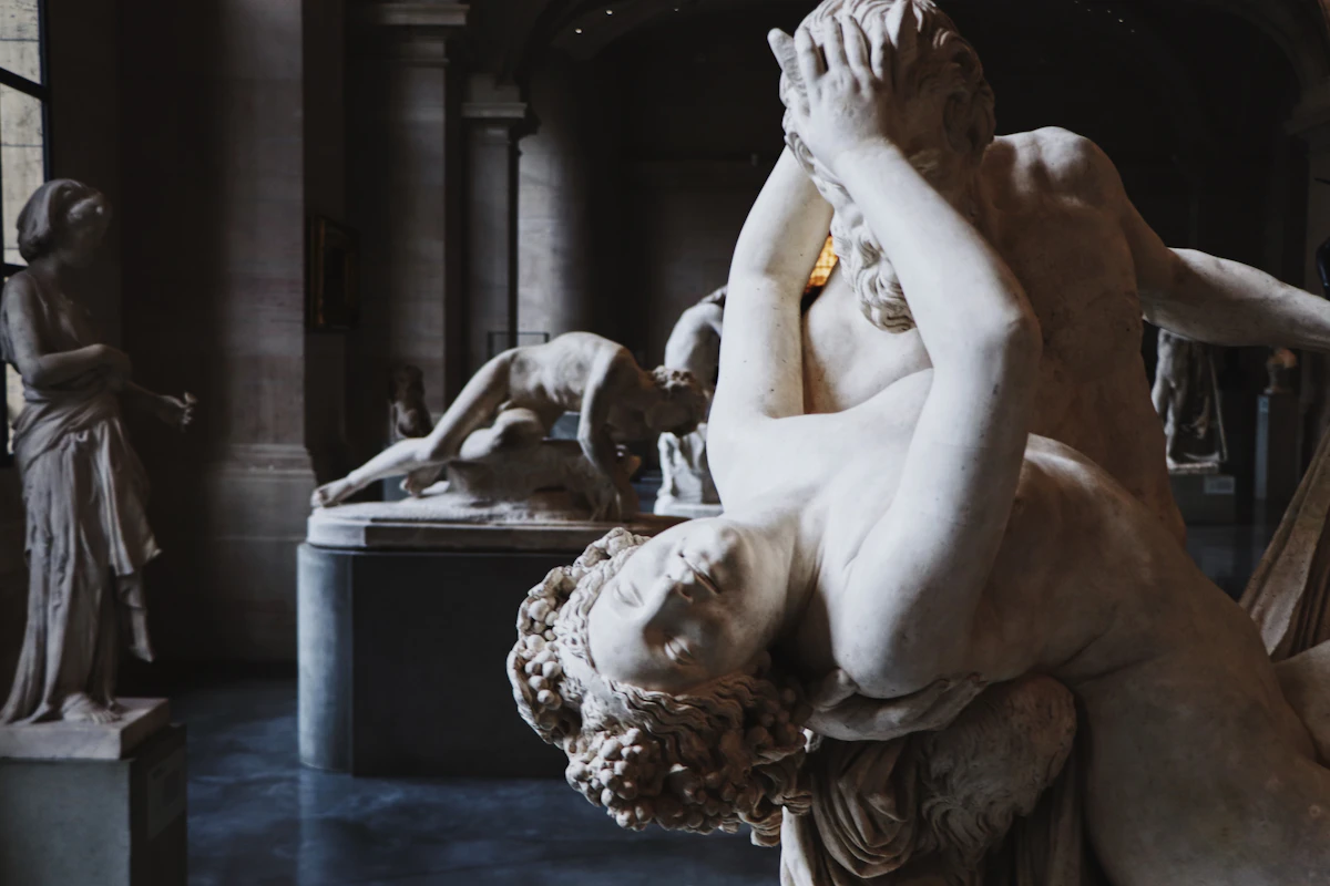 Classical marble sculptures in a quiet museum gallery