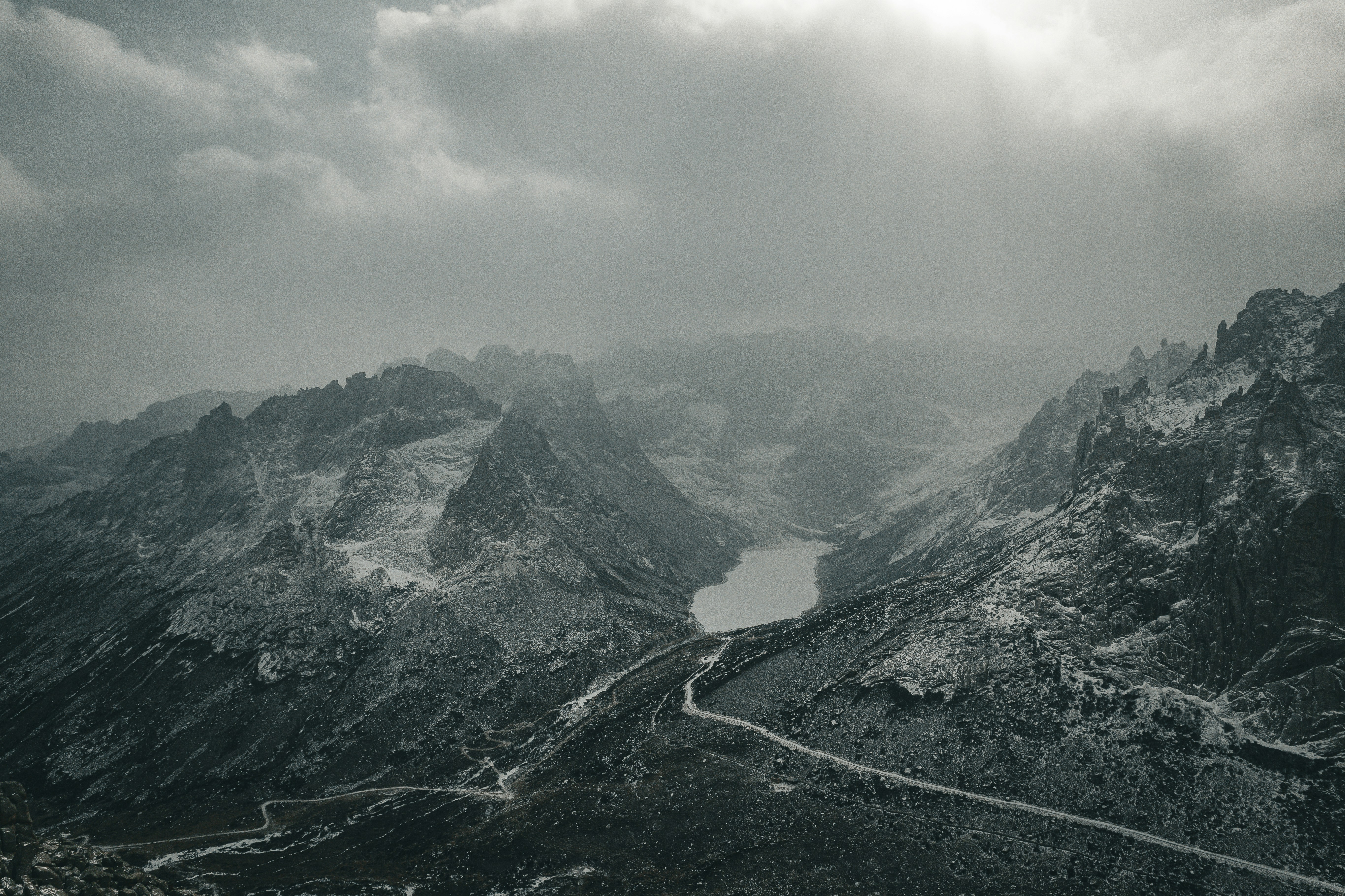 a black and white photo of a mountain range