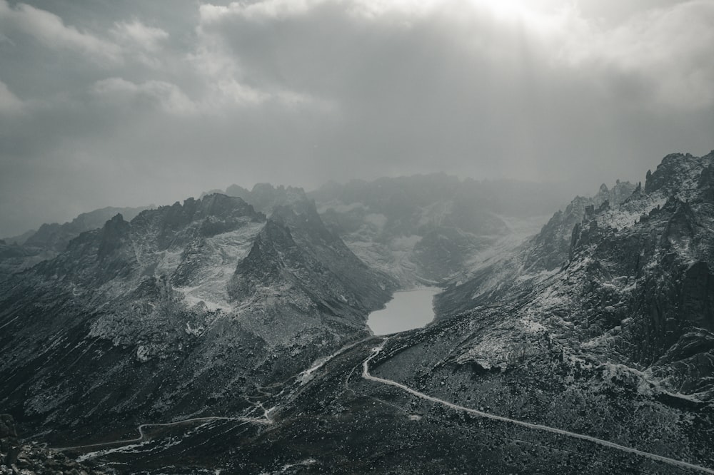 a black and white photo of a mountain range