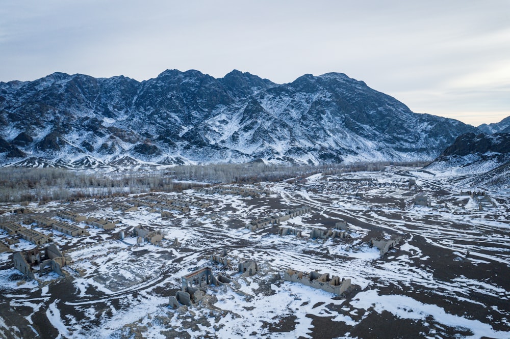 an aerial view of a snow covered mountain range