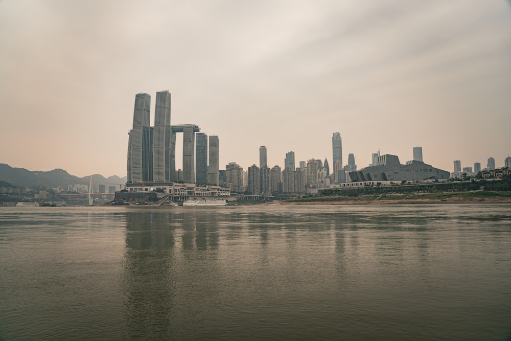 a body of water with a city in the background