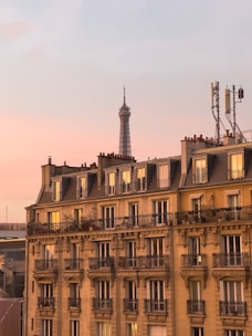 Elegant Parisian office building with classic architecture at sunset.